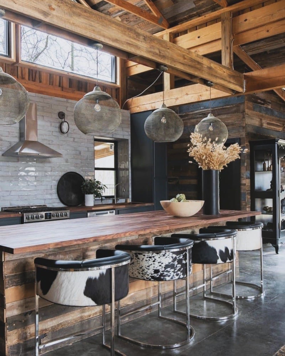 17. Rustic Wood and Black Accents With Cowhide Seating - barndo kitchen ideas