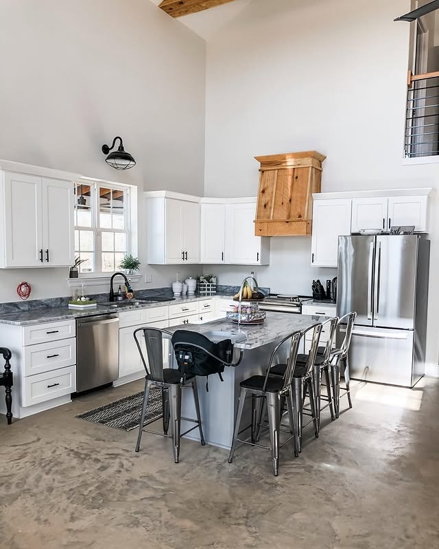 19. Bright White Kitchen With Industrial Seating - barndo kitchen ideas
