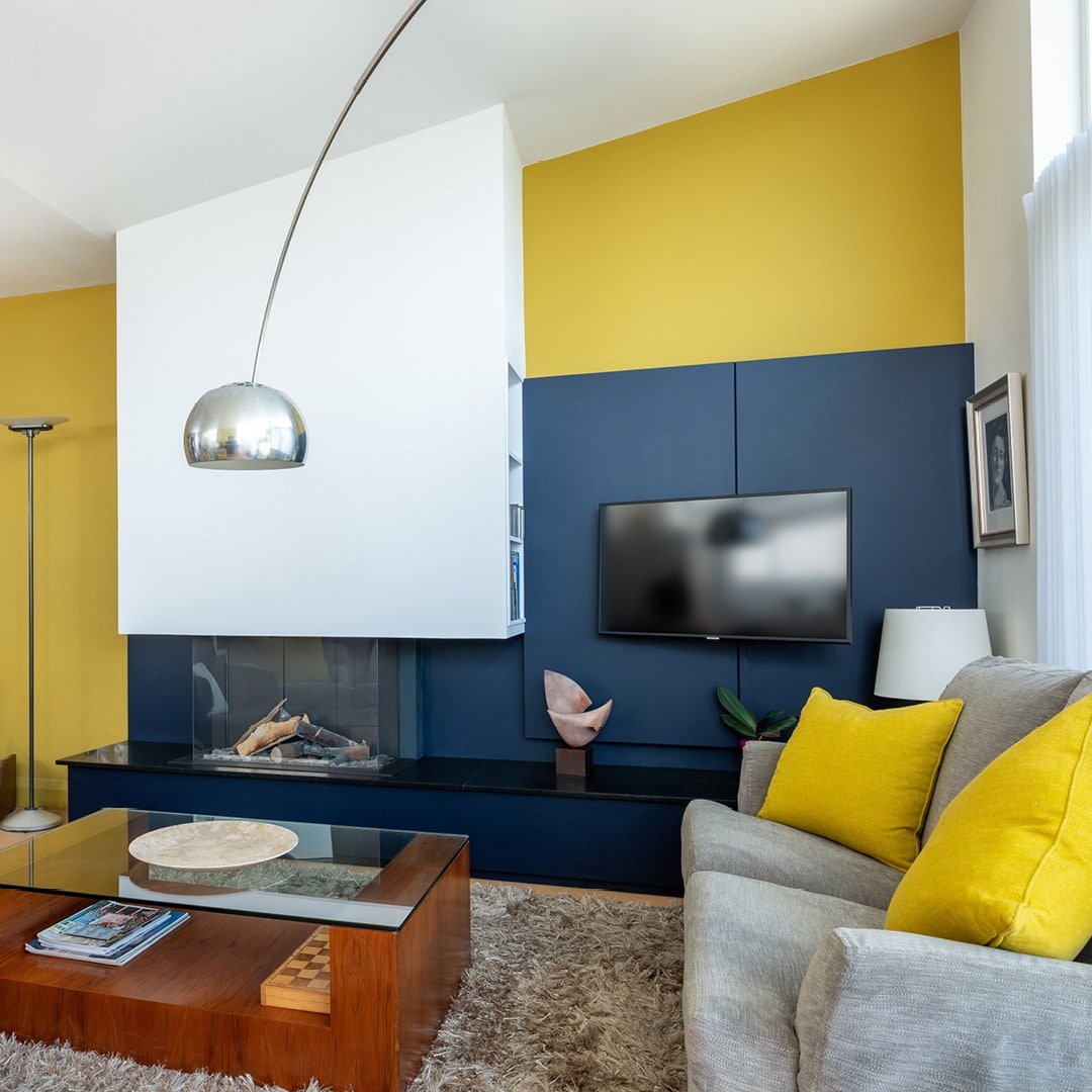 1. Modern Contrast with Bold Color Blocking - yellow and blue living room ideas