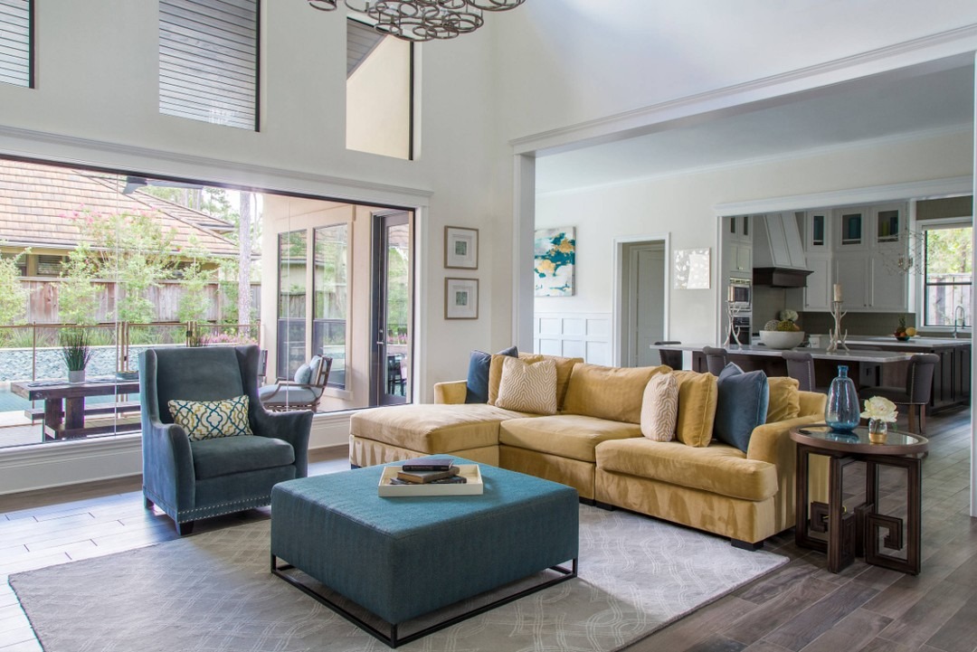 6. Open-Concept Living with Tailored Neutrals and Blue Accents - yellow and blue living room ideas