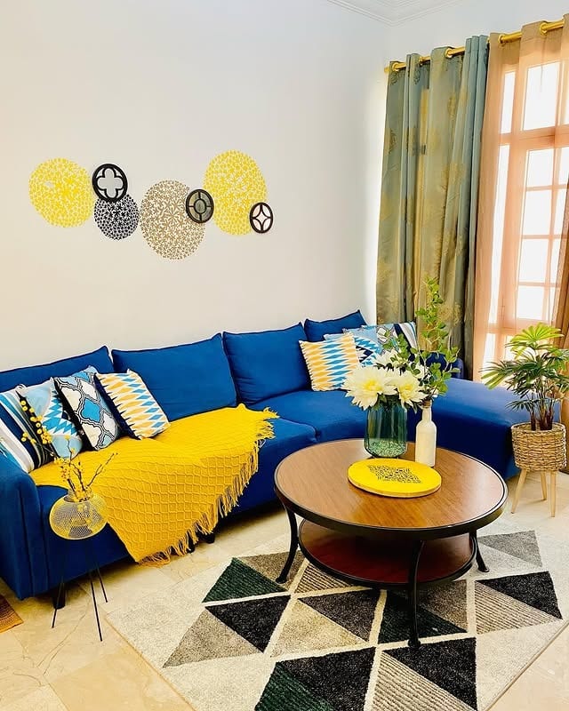 8. Bright Corner Seating with Playful Patterns - yellow and blue living room ideas