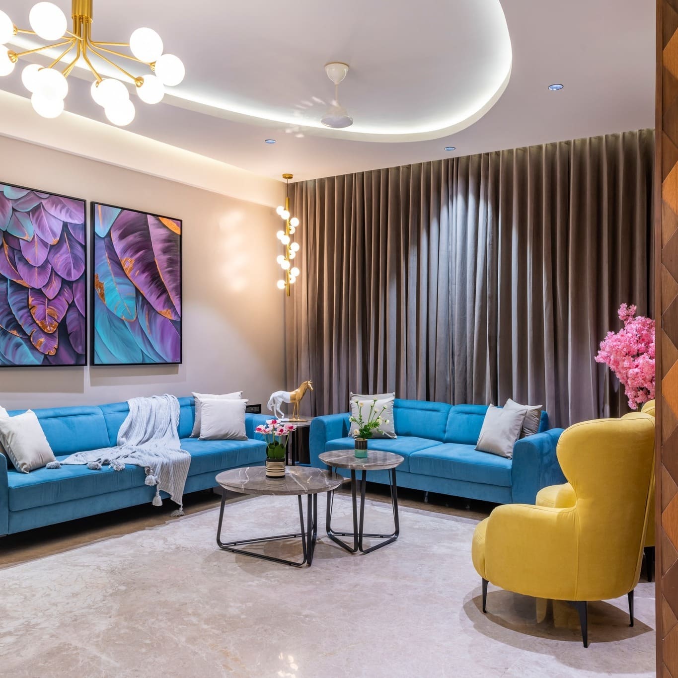 14. Soft Glam Living with Aqua Blues and a Golden Accent Chair - yellow and blue living room ideas