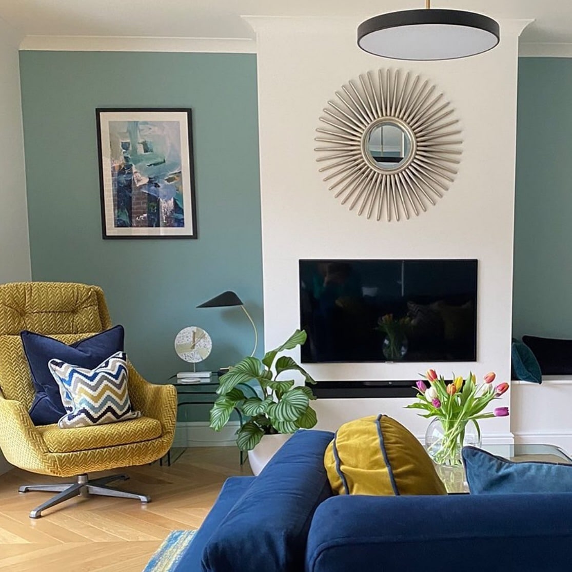 15. Modern Teal Feature Wall with Rich Blue and Mustard Details - yellow and blue living room ideas