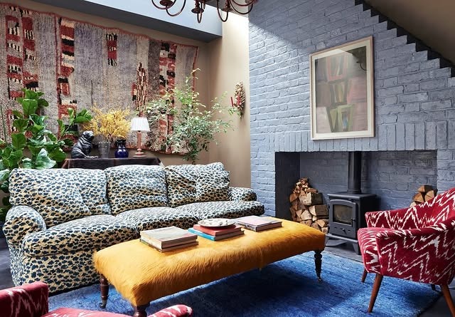 20. Eclectic Mix with Patterned Upholstery and a Golden Bench - yellow and blue living room ideas