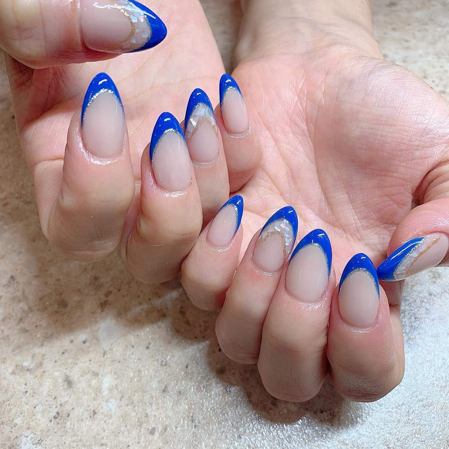 4. Royal Blue Geode French - blue french nail ideas