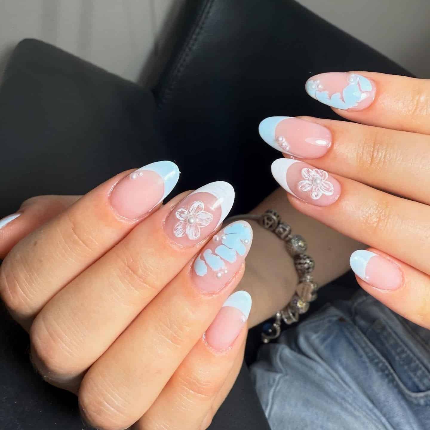 11. Pastel Blossom Blue French Almond - blue french nail ideas