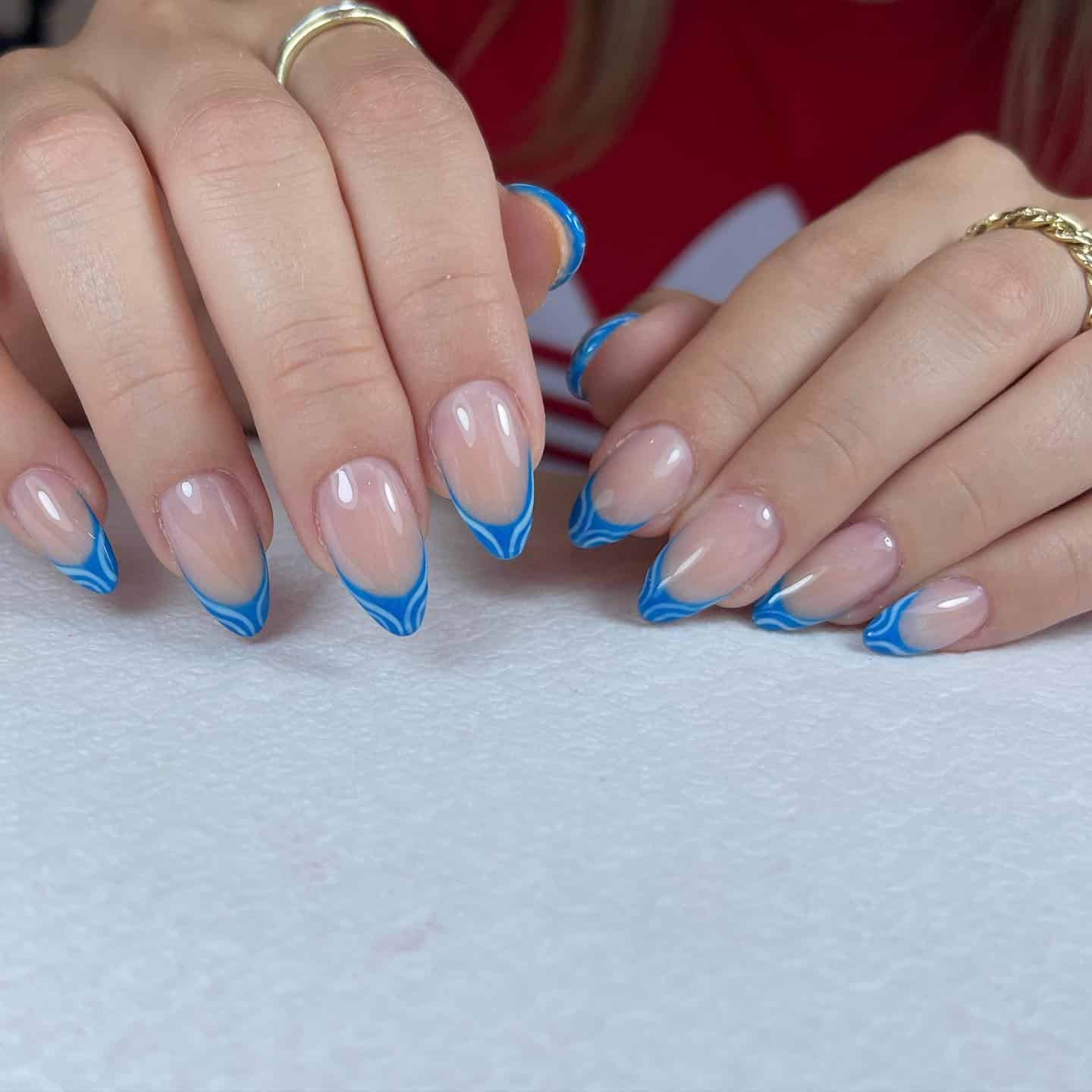 13. Dual-Tone Wave Blue French Almond - blue french nail ideas