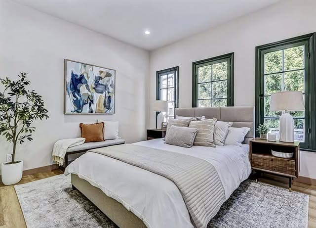 7. Light-Filled Neutrals with Warm Saddle Accents - fall bedroom ideas