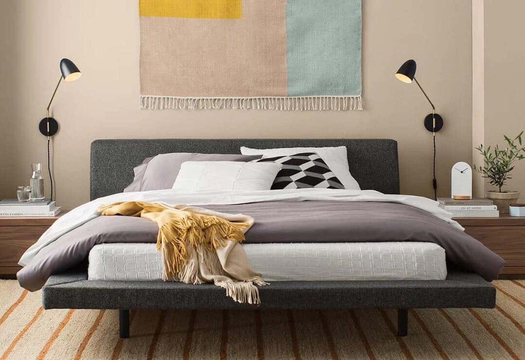 3. Graphic Simplicity With Charcoal and Pastels - mid century bedroom ideas