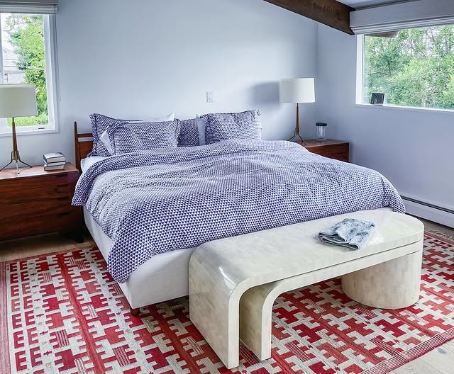 12. Crisp Blues Over a Retro Geometric Rug - mid century bedroom ideas