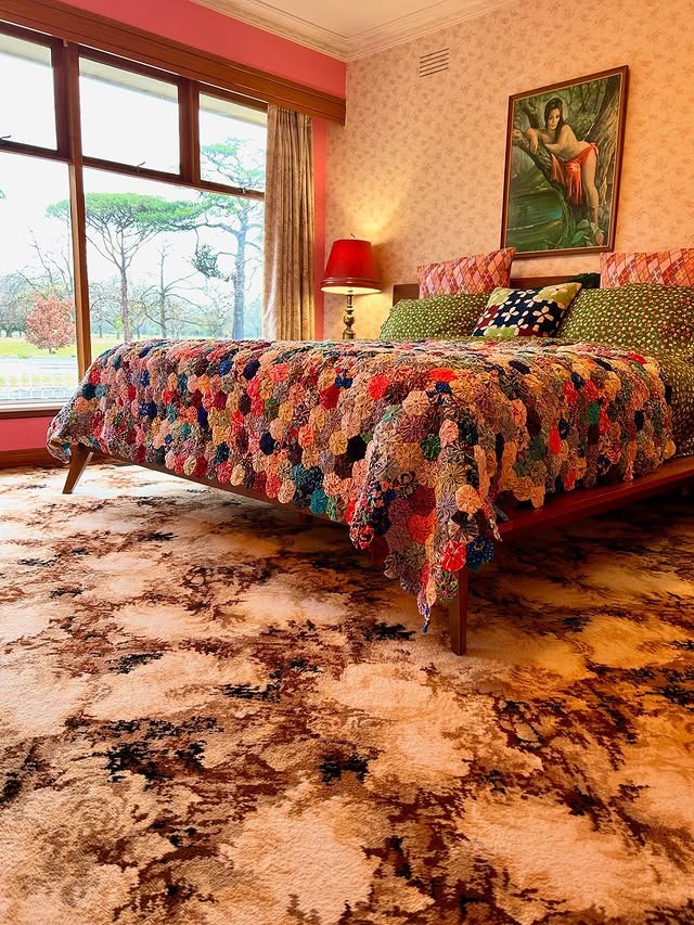 16. Patchwork Charm With Retro Pink Walls - mid century bedroom ideas