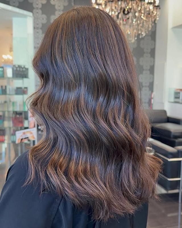 12. Muted Caramel Glow on Sculpted Waves - Caramel Balayage with Highlights