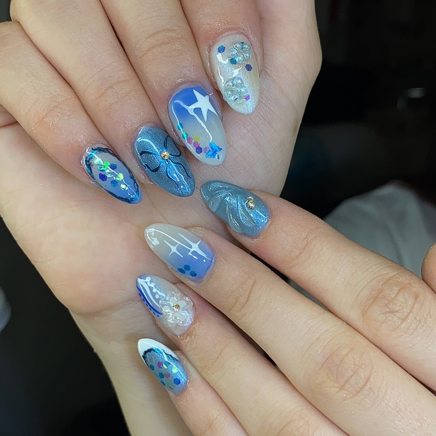 1. Shimmer Blue Butterfly Accent Nails - blue summer nail ideas