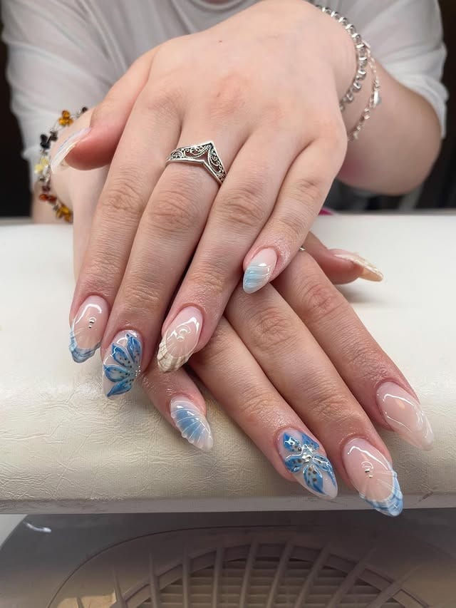 9. Pastel Blue Butterfly Wing Nails - blue summer nail ideas