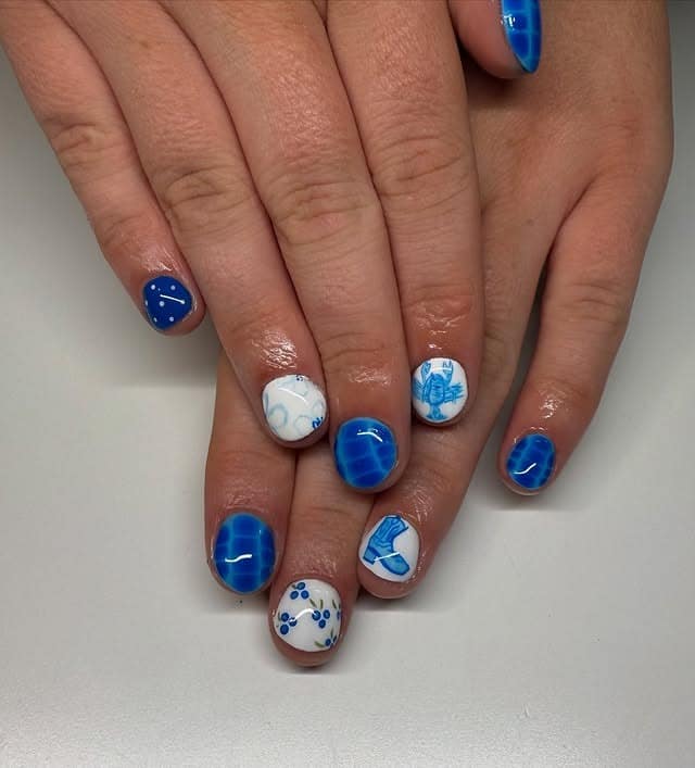 14. Mini Ocean Icons & Cobalt Accents - blue summer nail ideas