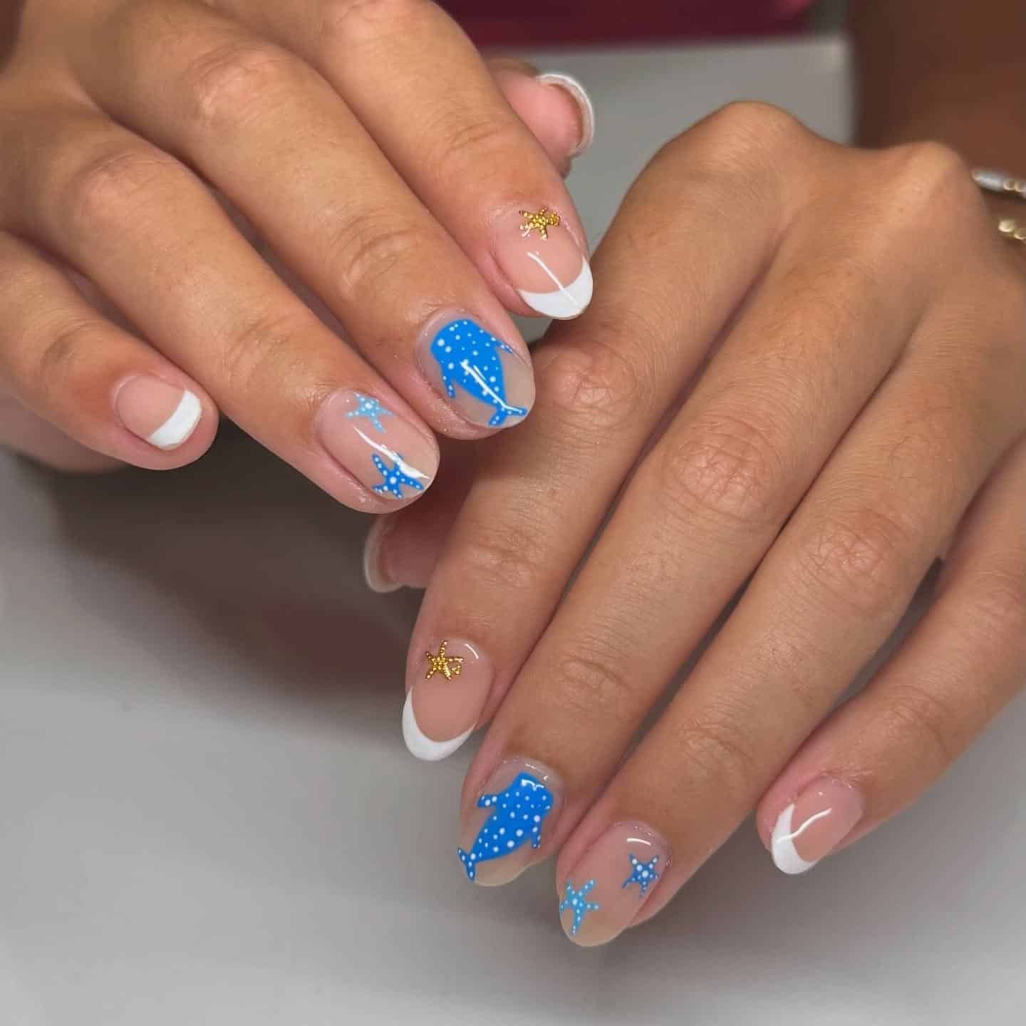 16. French Tips with Blue Sea Creatures - blue summer nail ideas