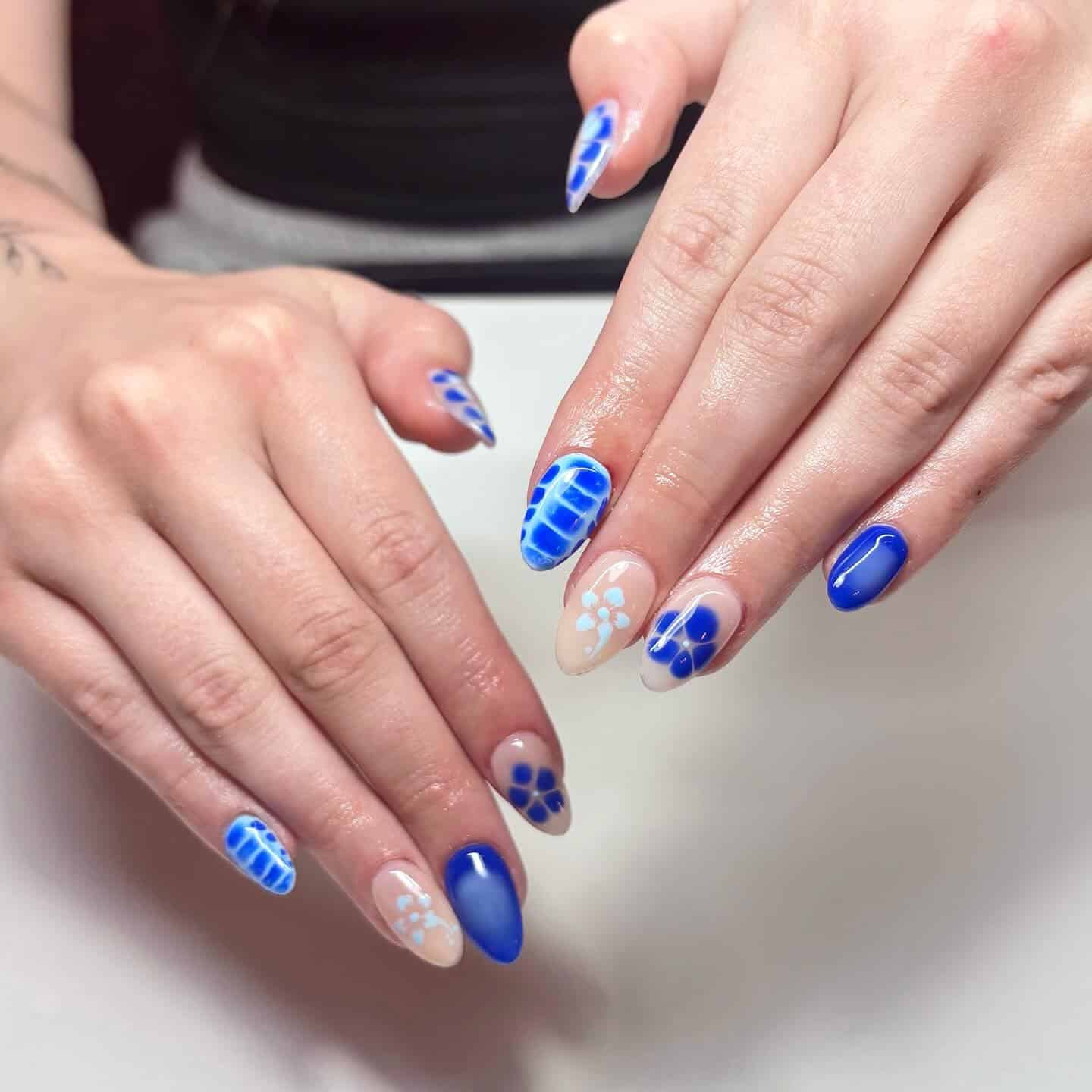 17. Ripple Blue Mix with Soft Florals - blue summer nail ideas