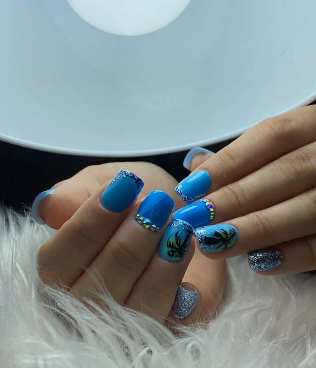 20. Bold Blue Squares with Palm Silhouettes - blue summer nail ideas