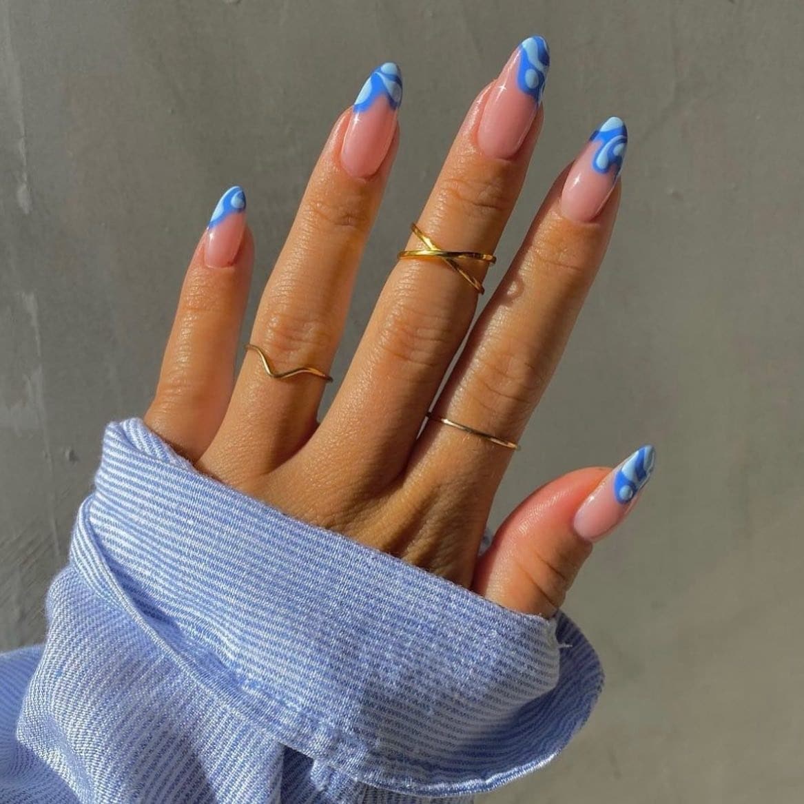 22. Sky Blue Swirl French Almond Nails - blue summer nail ideas