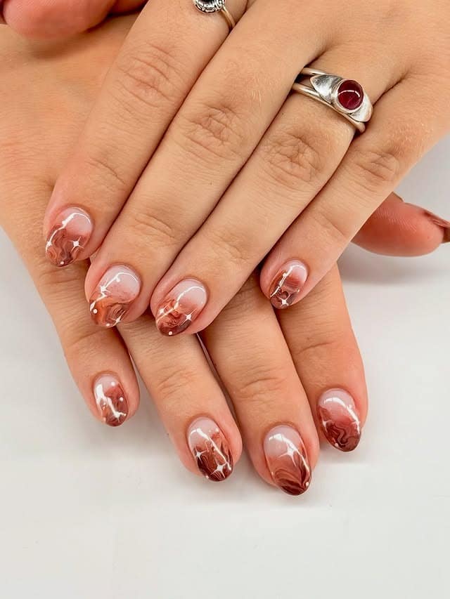 7. Soft Brown Marble Fade - brown fall nail ideas