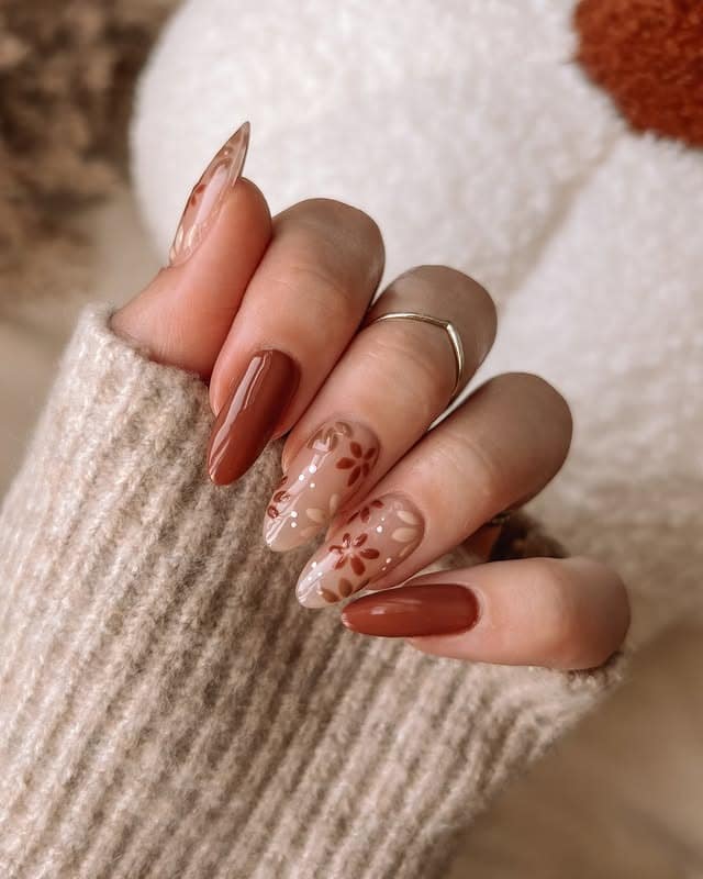 15. Rust Floral Accents & Glossy Solids - brown fall nail ideas