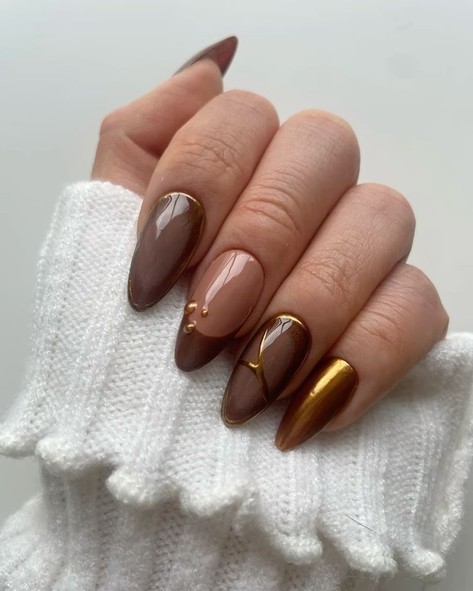 19. Gold-Lined Chocolate Almond Nails - brown fall nail ideas