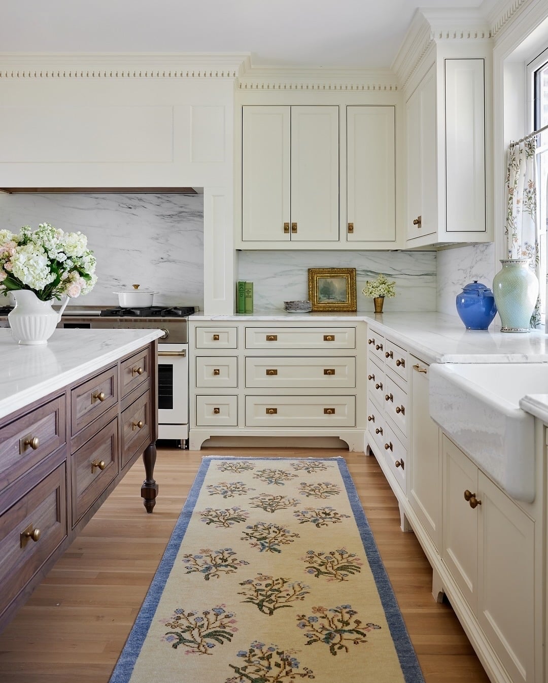 1. Classic Cream Cabinetry with Soft Floral Runner - kitchen rug ideas