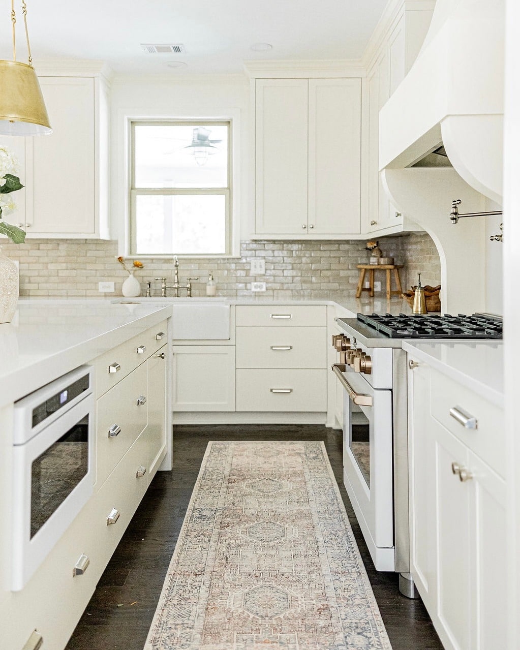 7. Soft White Kitchen with Faded Pastel Runner - kitchen rug ideas