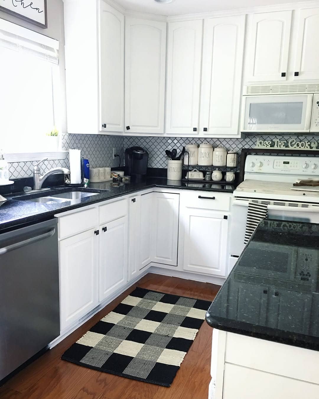 9. Black-and-White Check Rug in Clean White Kitchen - kitchen rug ideas