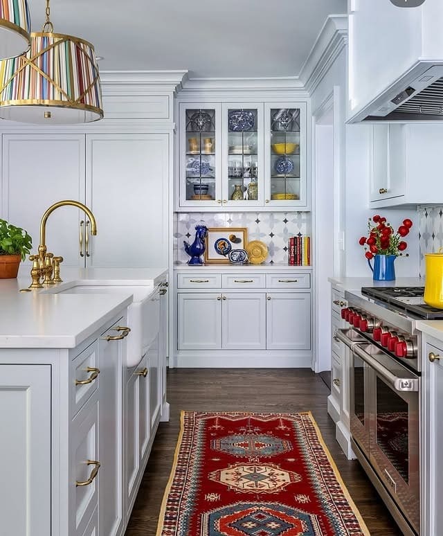 11. Crisp White Kitchen with Bold Red Runner - kitchen rug ideas