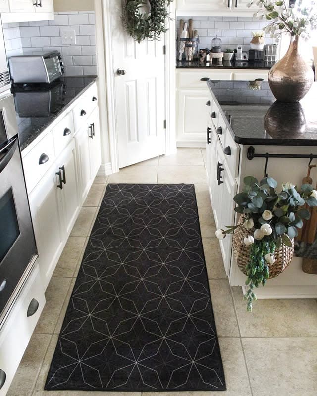 14. Black Countertops Paired with a Charcoal Geometric Runner - kitchen rug ideas