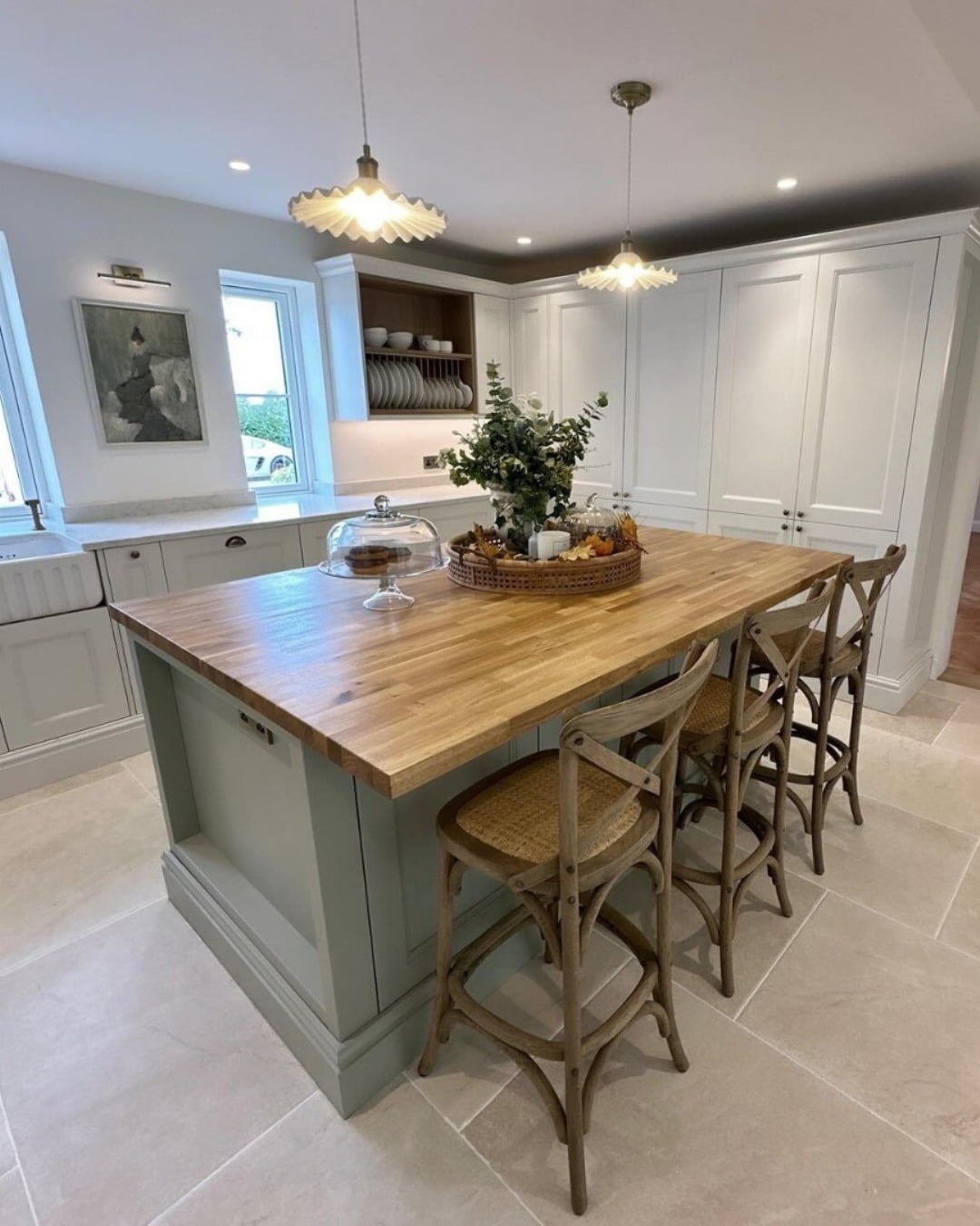 8. Sage Island & Classic White Cabinetry with Farmhouse Touches - two tone kitchen ideas