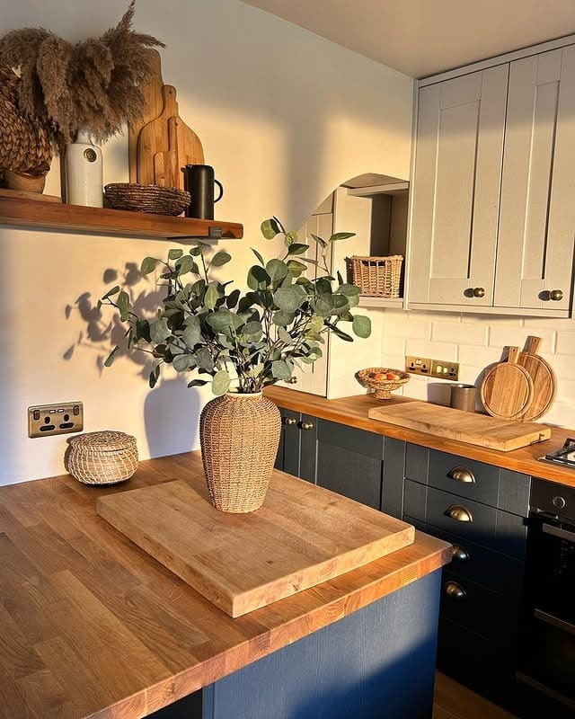 9. Navy & White Kitchen with Warm Butcher Block Accents - two tone kitchen ideas