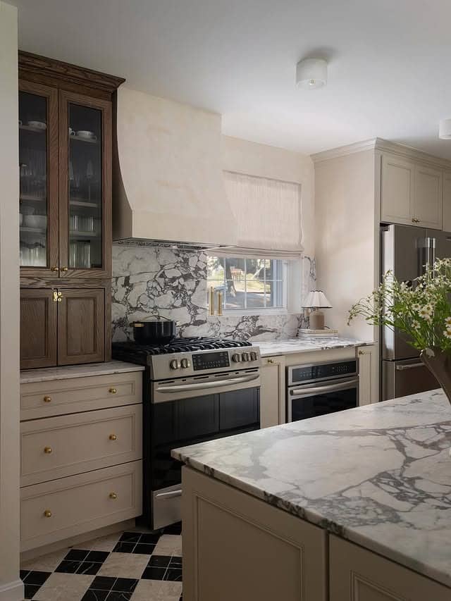 12. Cream & Charcoal Kitchen with Dramatic Marble Patterning - two tone kitchen ideas