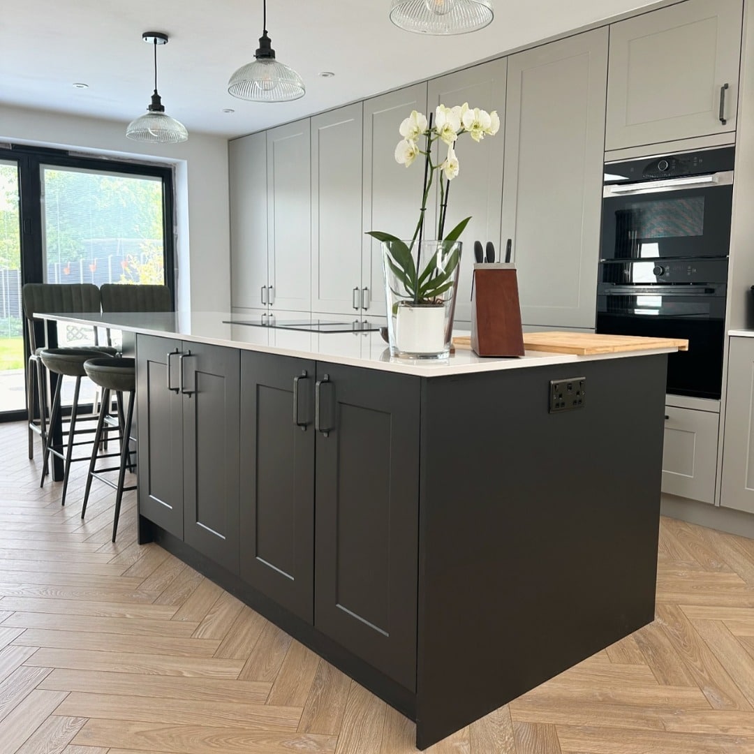15. Graphite Island with Light Grey Cabinets and Glass Pendants - two tone kitchen ideas