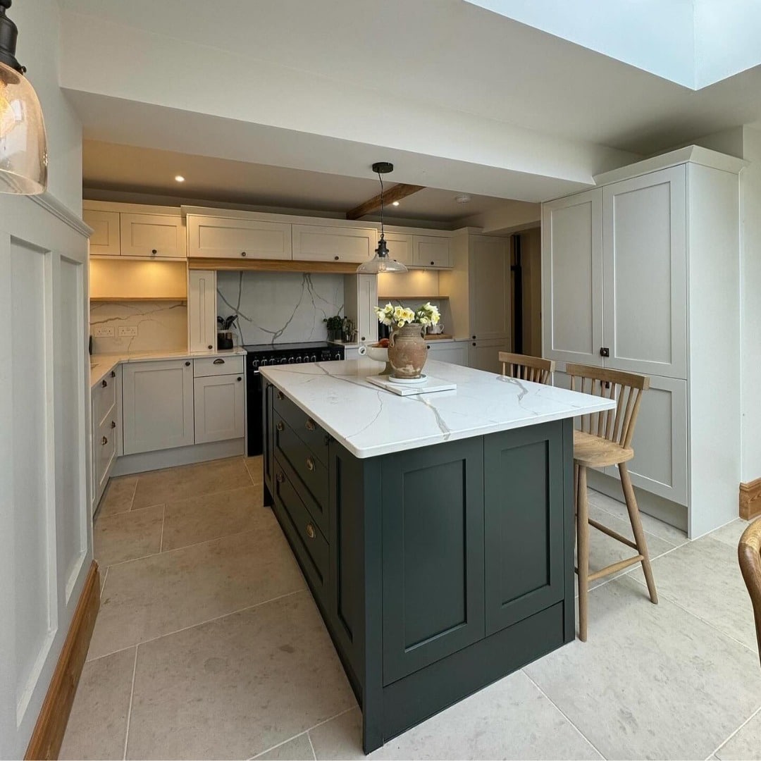 16. Deep Green Island with Cream Perimeter Cabinets and Marble Detail - two tone kitchen ideas