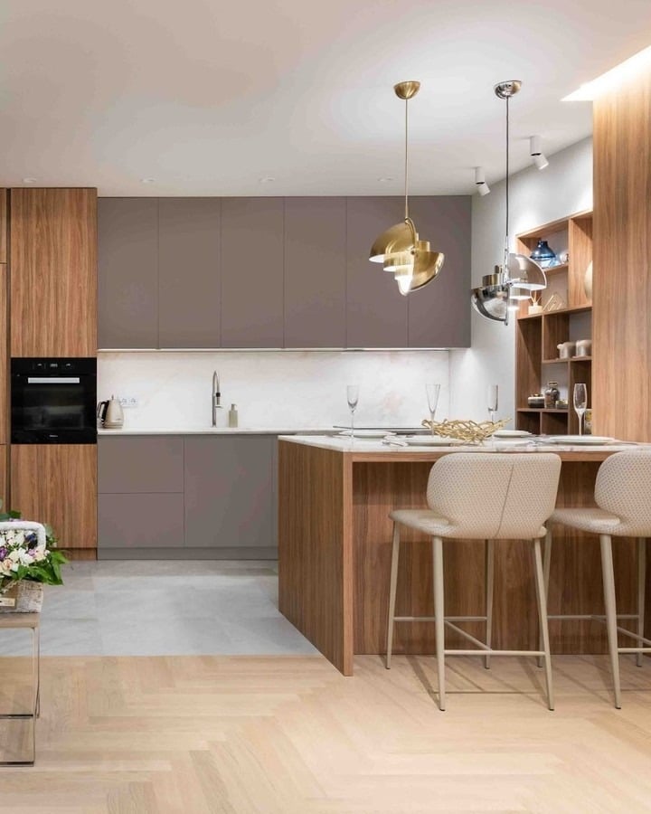 17. Warm Walnut & Soft Taupe Kitchen with Sculptural Pendants - two tone kitchen ideas