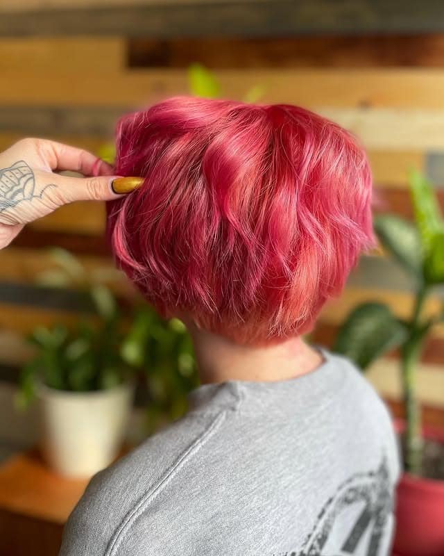 5. Vibrant Pink Wavy Pixie - Long Pixie Cuts