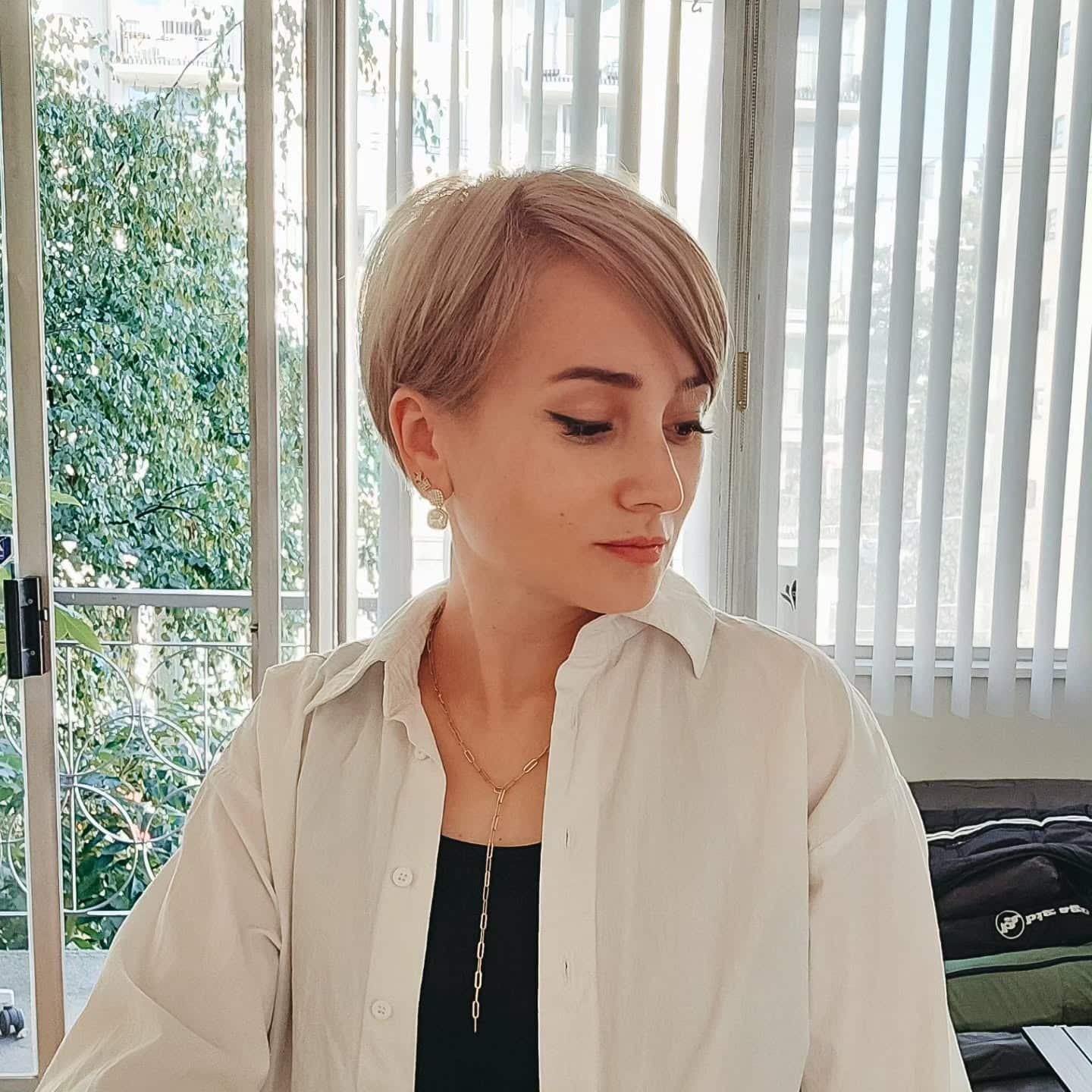 6. Cool Blonde Side-Swept Pixie - Long Pixie Cuts