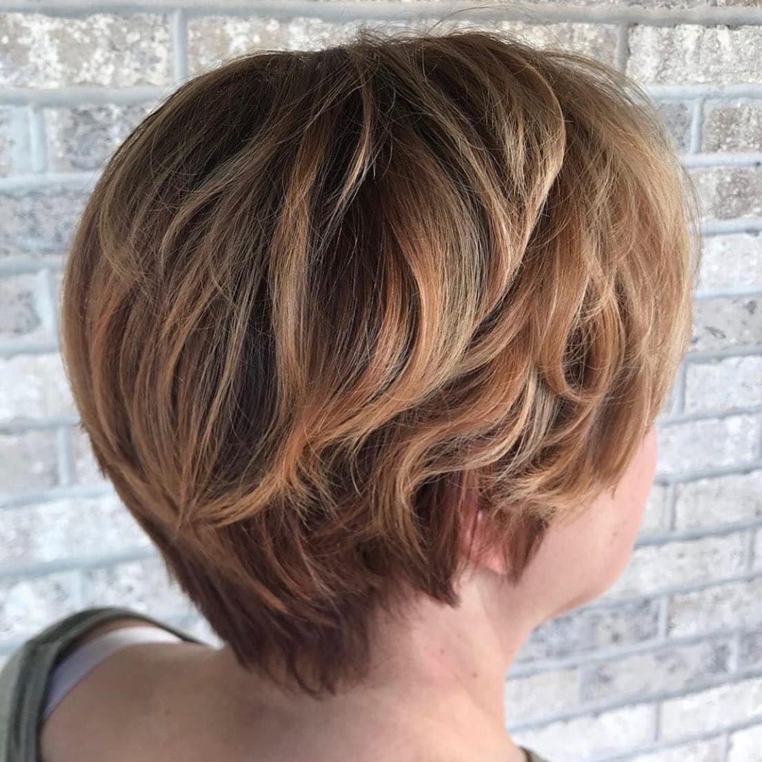 8. Golden Brown Layered Pixie Bob - Long Pixie Cuts
