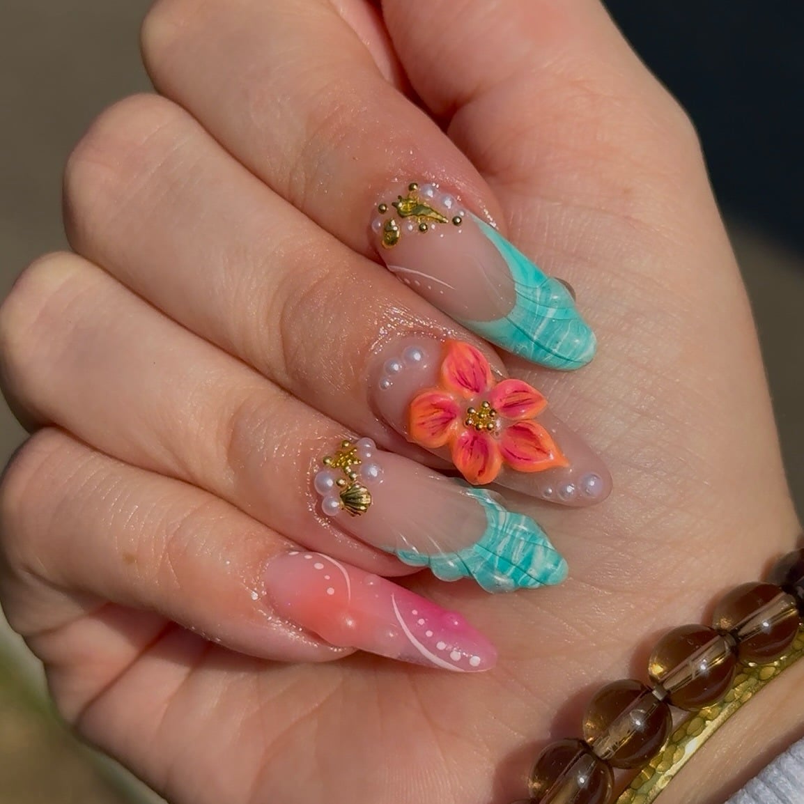 22. Tropical Breeze 3D Floral Almonds - caribbean nail ideas