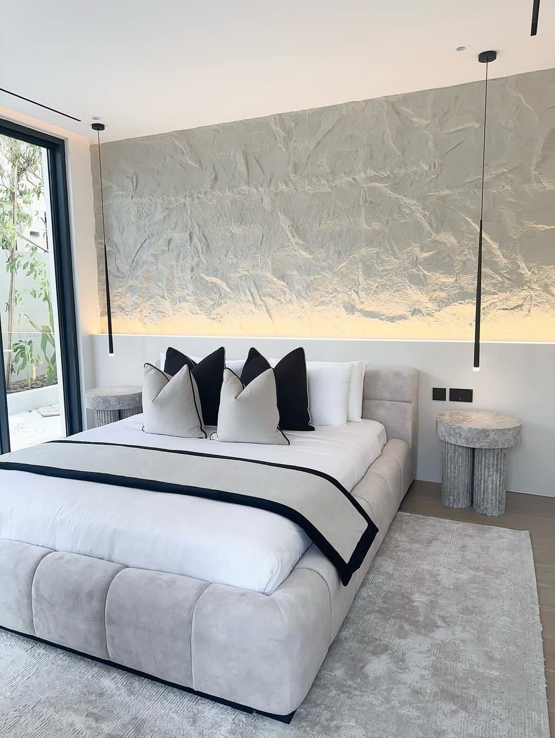 3. Sculpted Minimalism with Black Accents - black and cream bedroom ideas