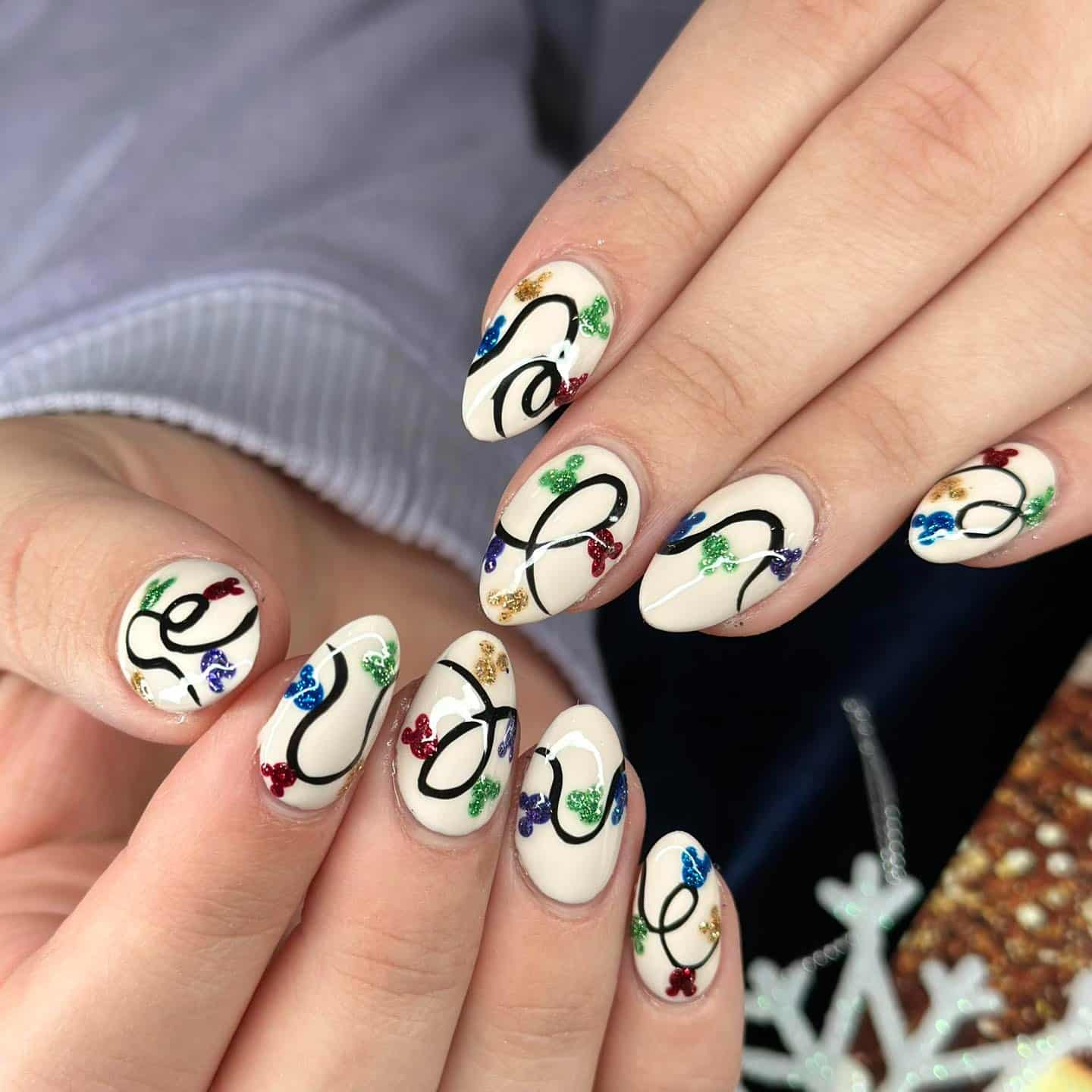 1. Cream Base Christmas Lights With Glitter Bulbs - christmas lights nail ideas