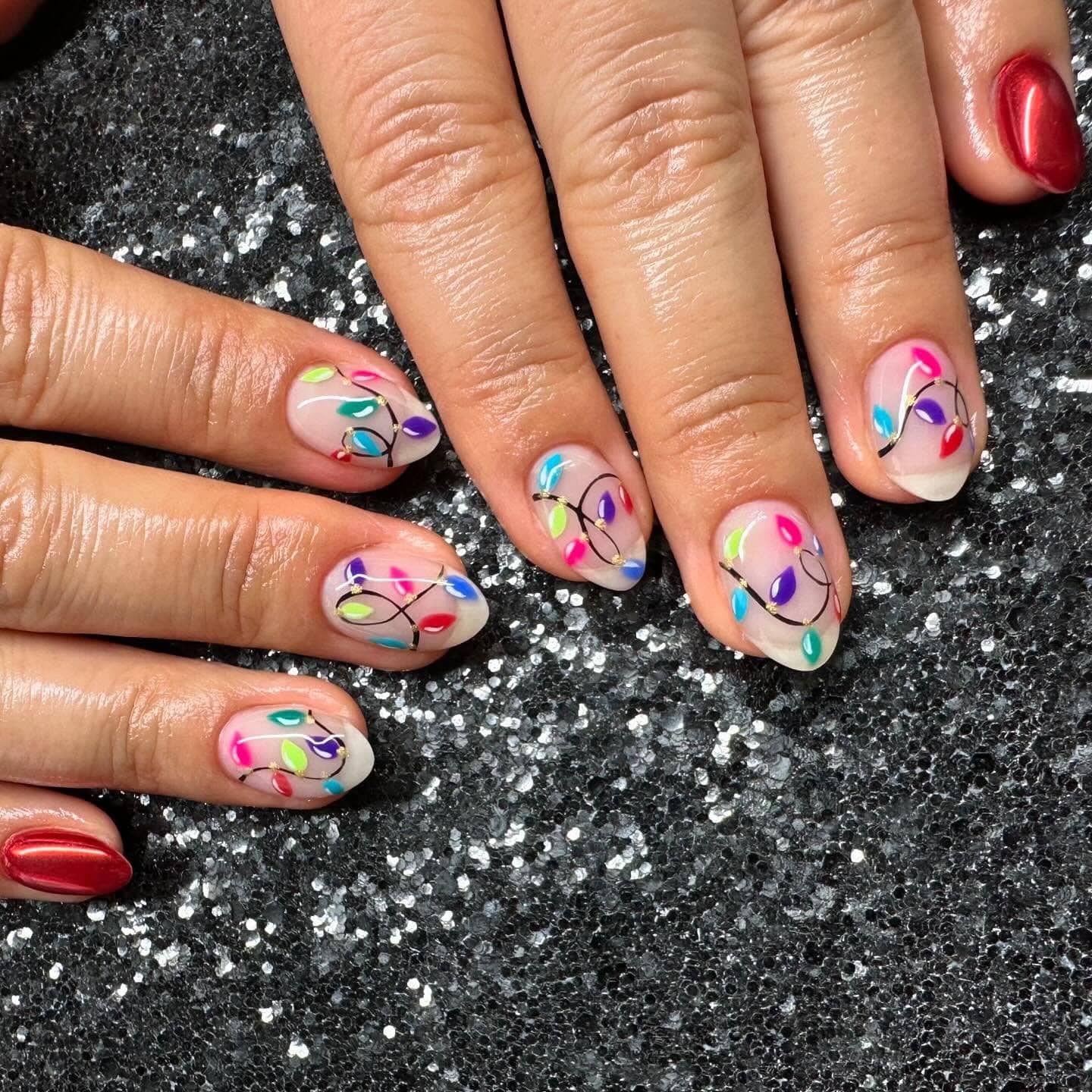 2. Sheer Bright Lights on Sparkle Background - christmas lights nail ideas