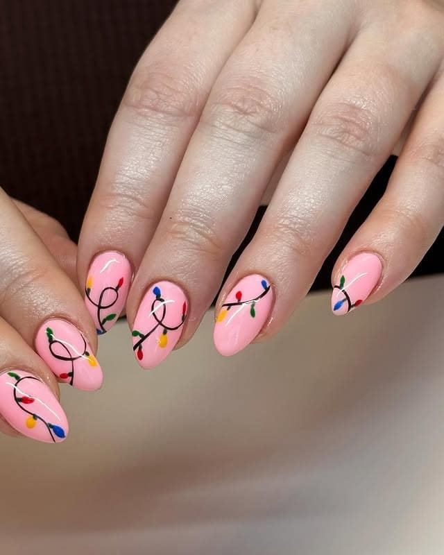 6. Pink Almond Nails With Classic Multicolor Lights - christmas lights nail ideas