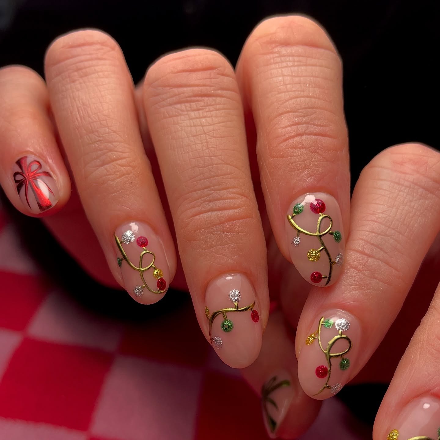 10. Gold-Trimmed Christmas Lights With Holiday Ribbon Accent - christmas lights nail ideas