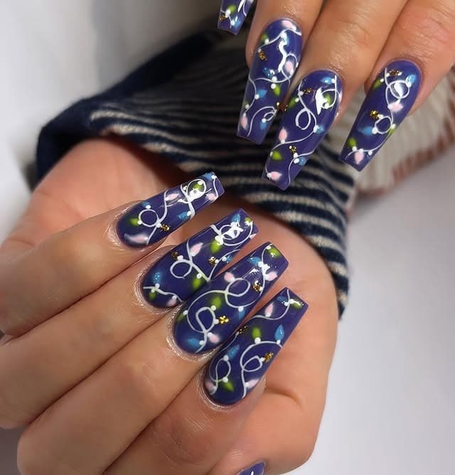 12. Galaxy Blue Christmas Lights on Long Coffin Nails - christmas lights nail ideas