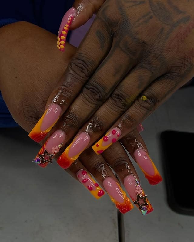 7. Sunset Flame Curve Nails with Star Charms - curved nail ideas