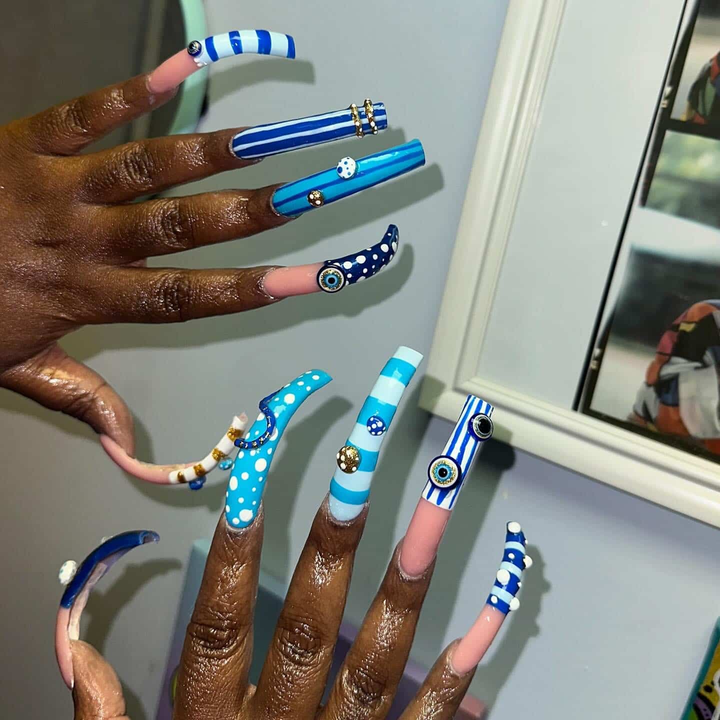 8. Ocean-Blue Curve Striped Nails - curved nail ideas