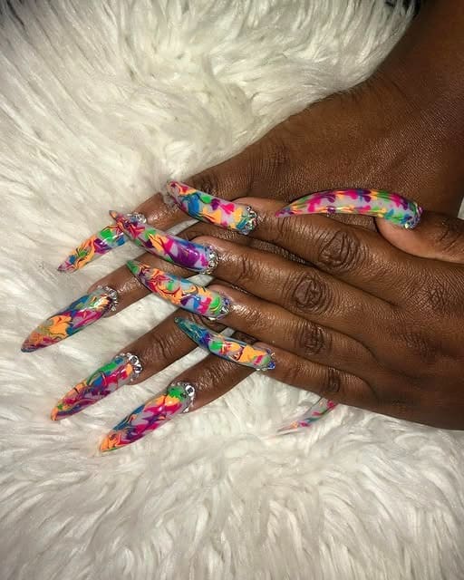 16. Color-Burst Curve Stiletto Nails with Crystal Accents - curved nail ideas